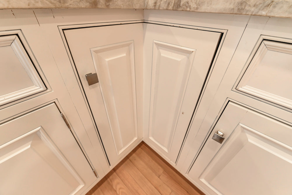 Traditional White Kitchen with Island, Appliances and Marble Countertops