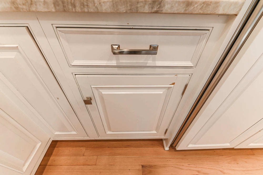Traditional White Kitchen with Island, Appliances and Marble Countertops