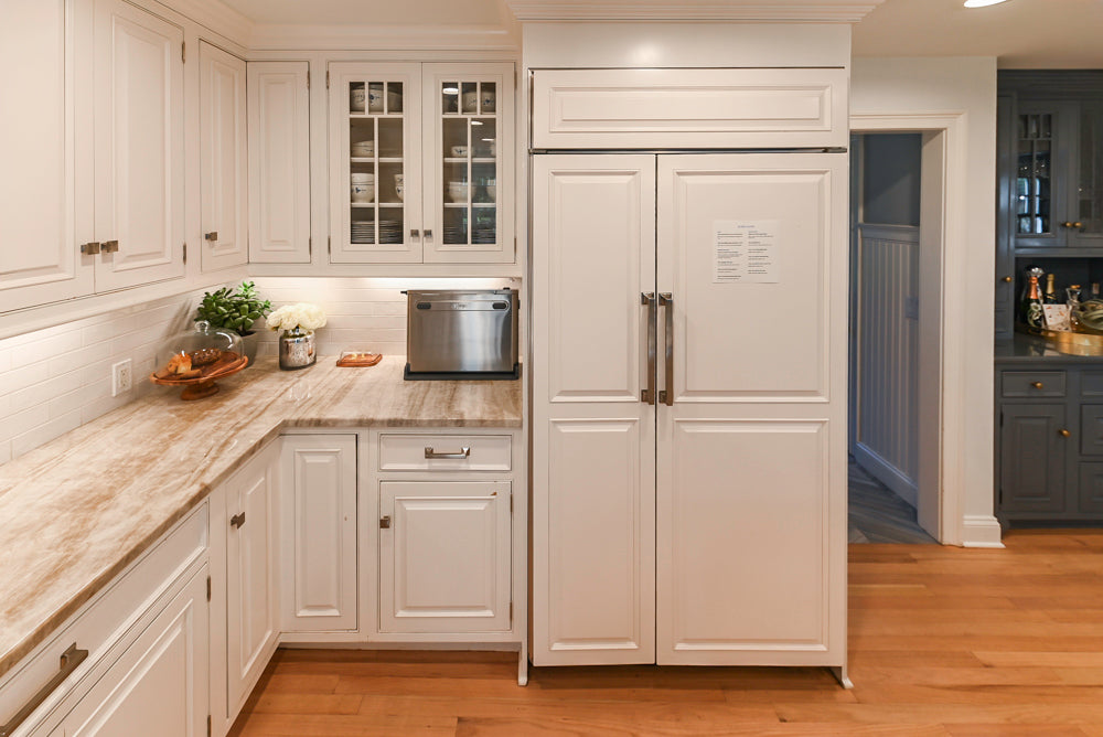 Traditional White Kitchen with Island, Appliances and Marble Countertops