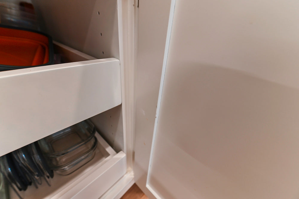 Traditional White Kitchen with Island, Appliances and Marble Countertops
