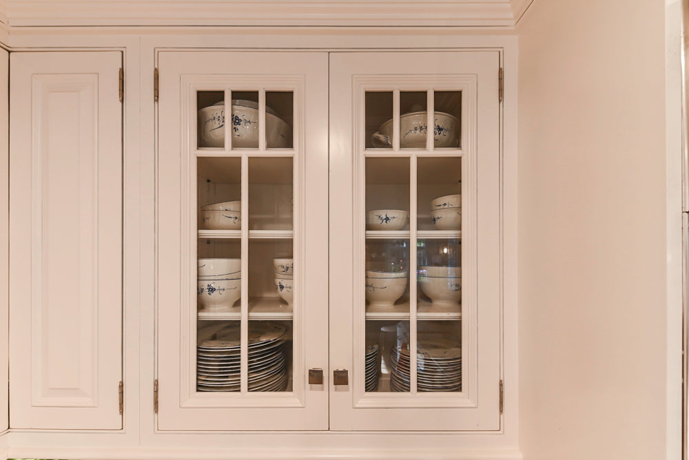 Traditional White Kitchen with Island, Appliances and Marble Countertops
