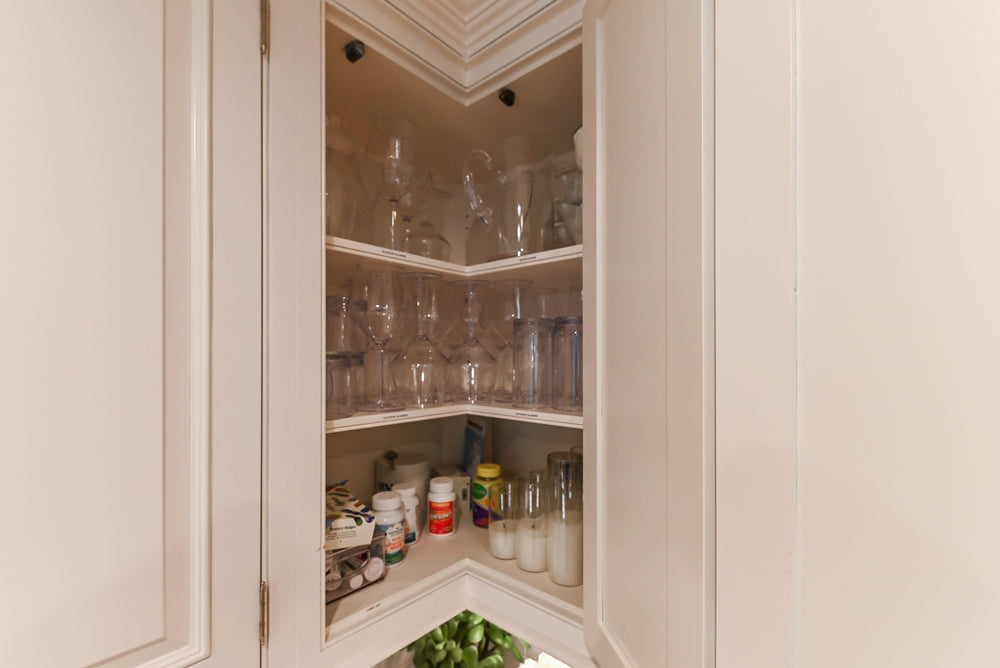 Traditional White Kitchen with Island, Appliances and Marble Countertops