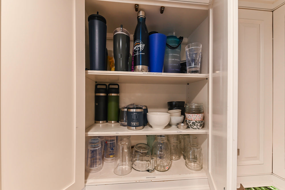 Traditional White Kitchen with Island, Appliances and Marble Countertops