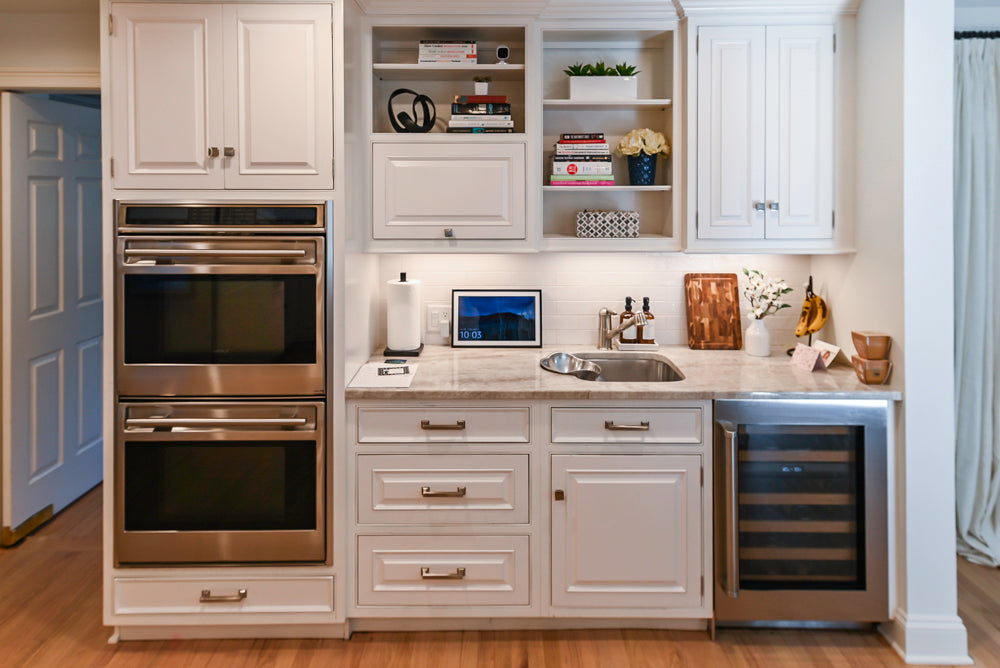 Traditional White Kitchen with Island, Appliances and Marble Countertops
