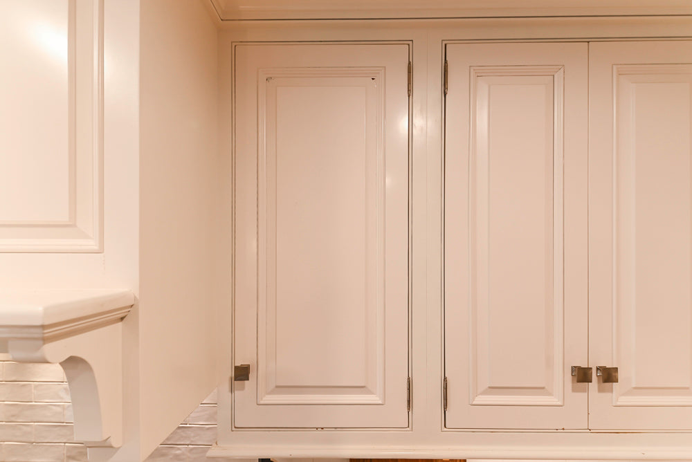 Traditional White Kitchen with Island, Appliances and Marble Countertops