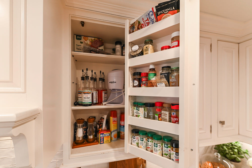 Traditional White Kitchen with Island, Appliances and Marble Countertops