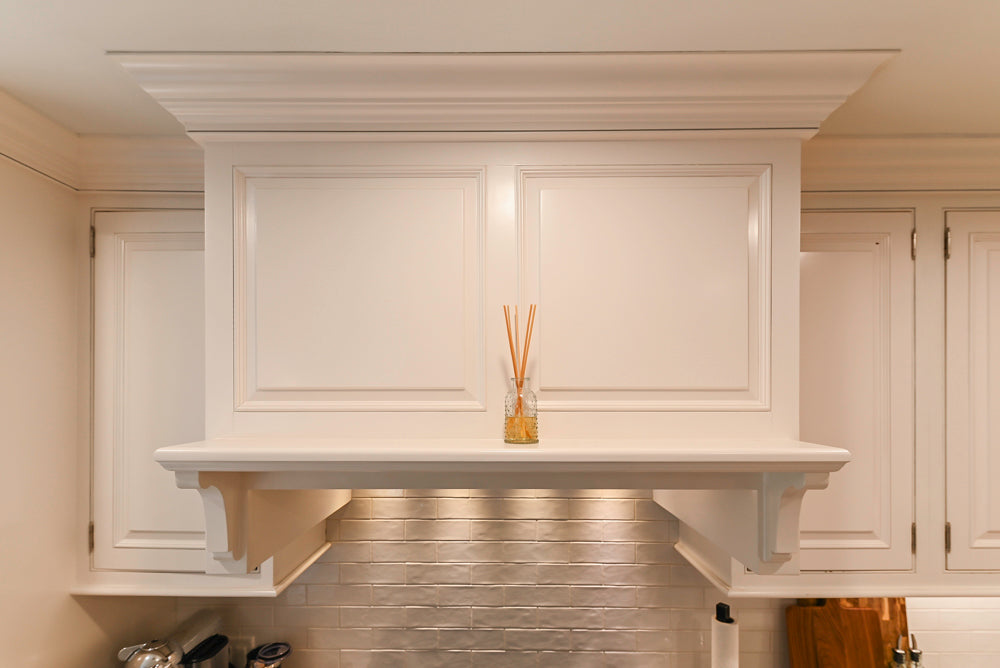 Traditional White Kitchen with Island, Appliances and Marble Countertops