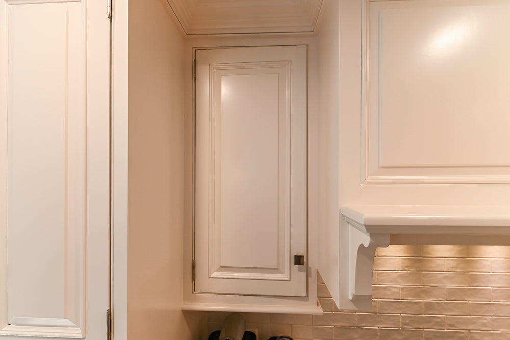 Traditional White Kitchen with Island, Appliances and Marble Countertops