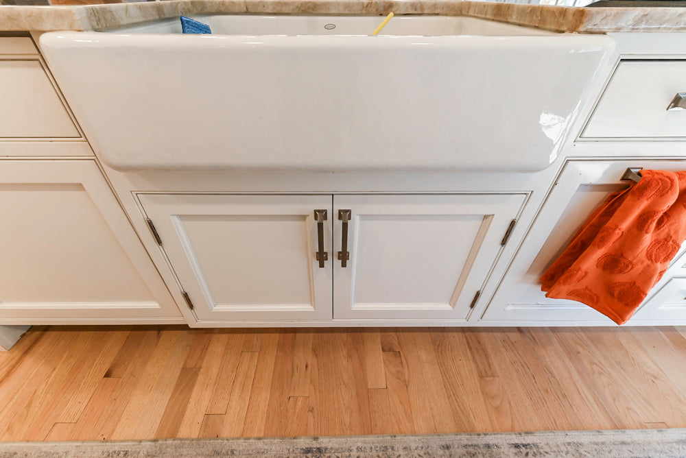 Traditional White Kitchen with Island, Appliances and Marble Countertops