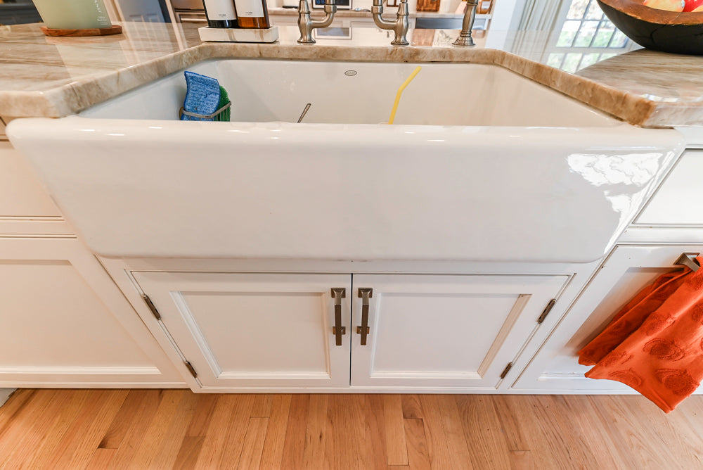 Traditional White Kitchen with Island, Appliances and Marble Countertops