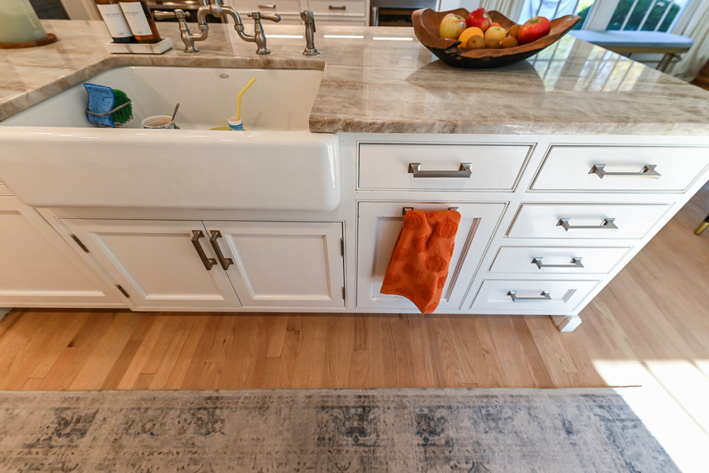 Traditional White Kitchen with Island, Appliances and Marble Countertops
