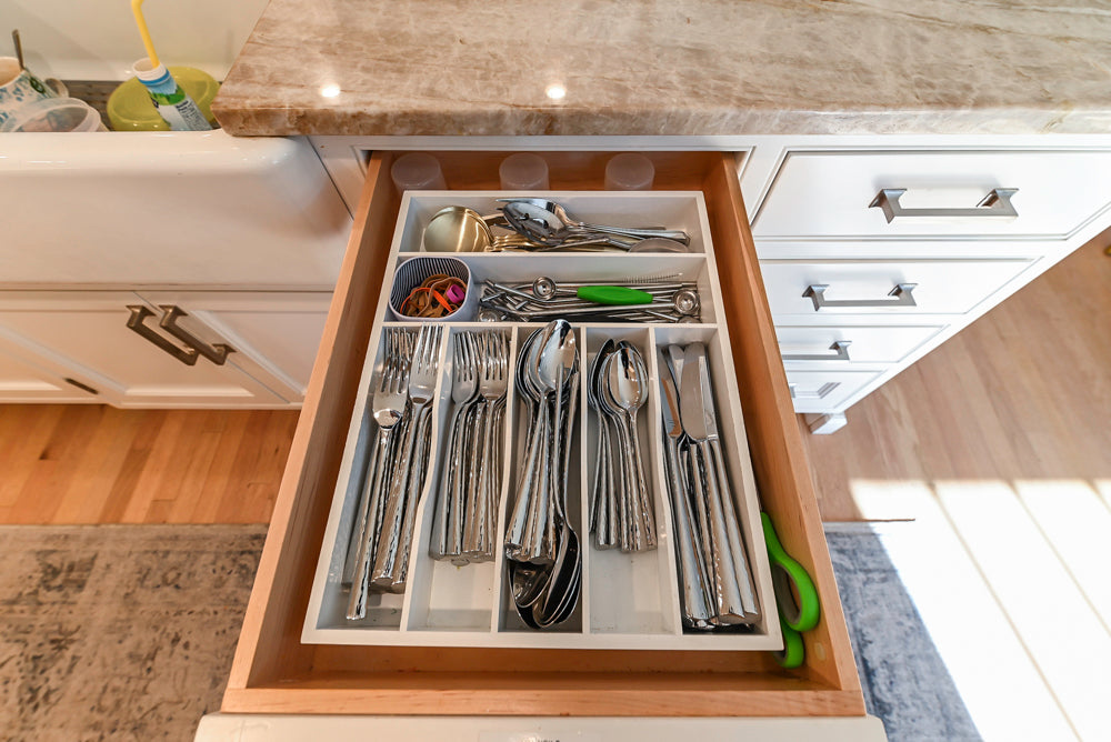 Traditional White Kitchen with Island, Appliances and Marble Countertops