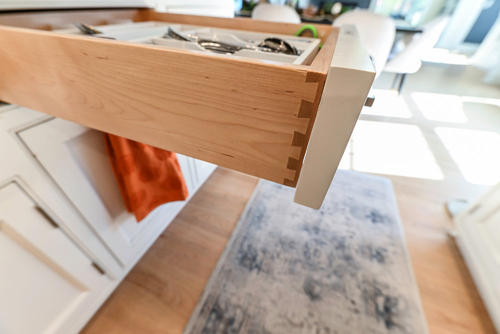 Traditional White Kitchen with Island, Appliances and Marble Countertops