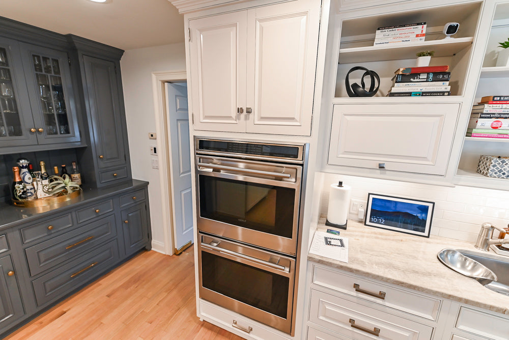Traditional White Kitchen with Island, Appliances and Marble Countertops