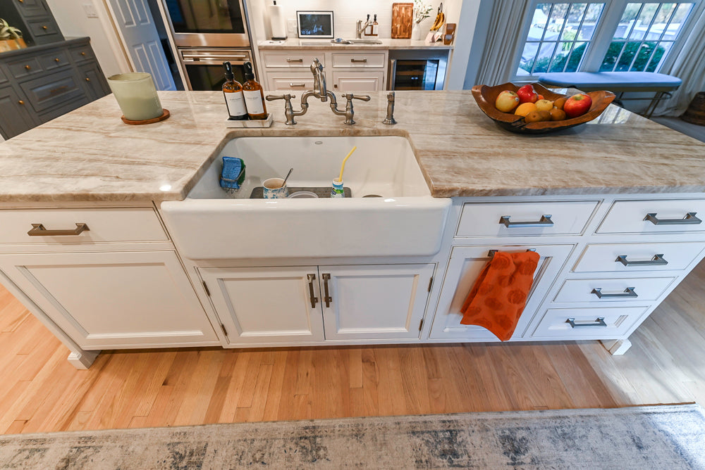 Traditional White Kitchen with Island, Appliances and Marble Countertops