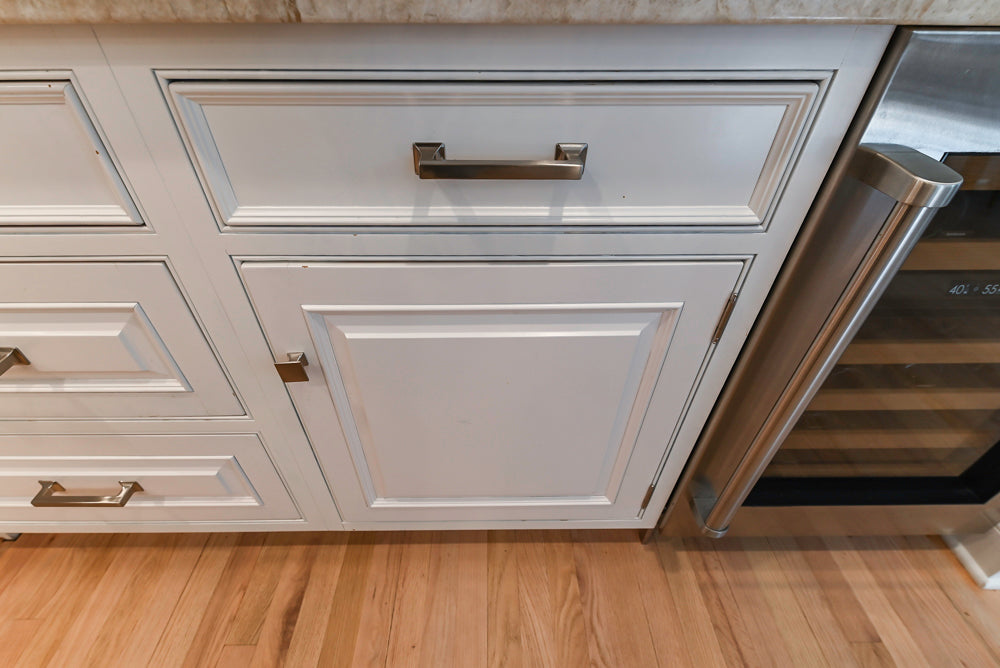 Traditional White Kitchen with Island, Appliances and Marble Countertops