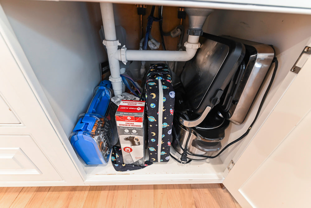 Traditional White Kitchen with Island, Appliances and Marble Countertops