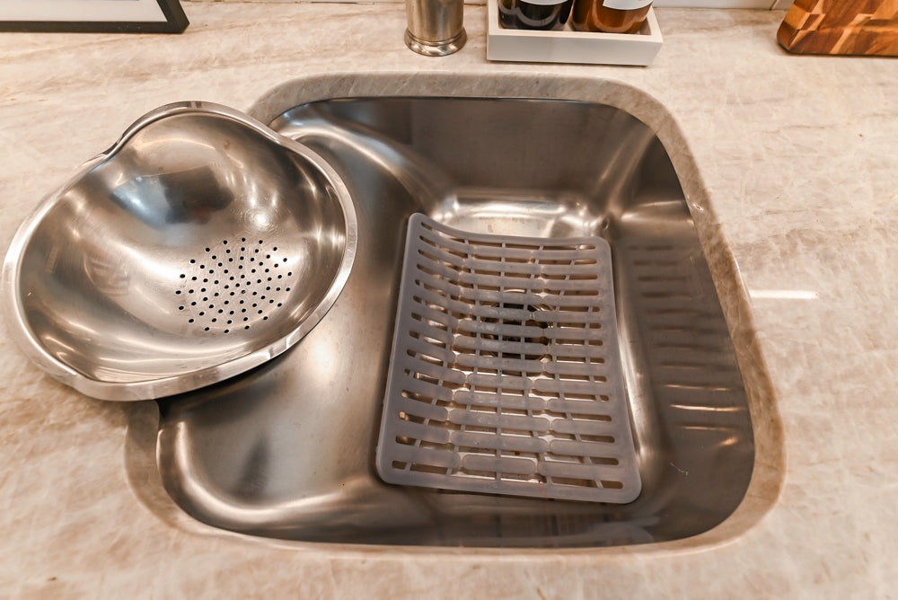 Traditional White Kitchen with Island, Appliances and Marble Countertops
