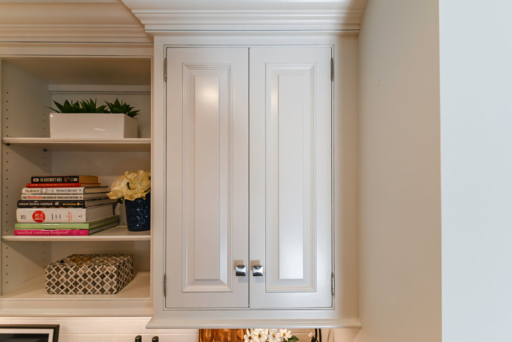 Traditional White Kitchen with Island, Appliances and Marble Countertops