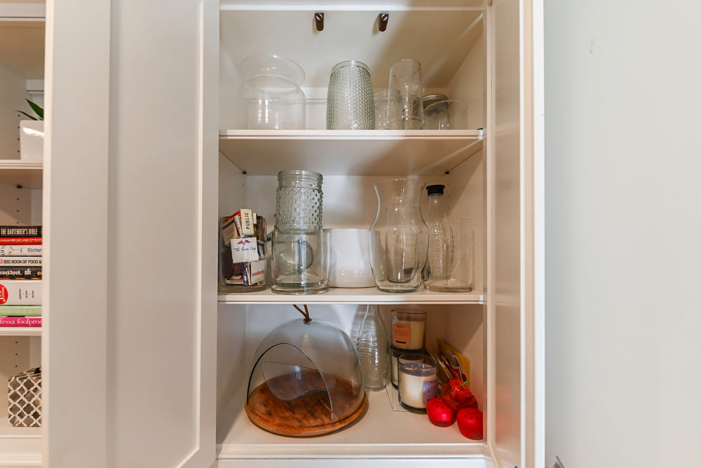 Traditional White Kitchen with Island, Appliances and Marble Countertops