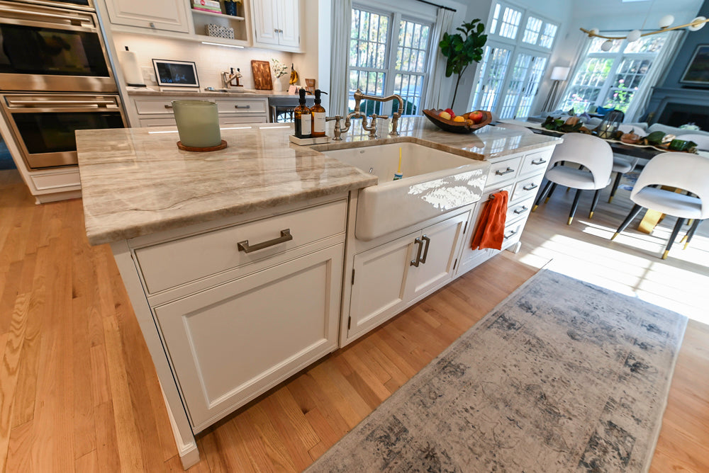 Traditional White Kitchen with Island, Appliances and Marble Countertops