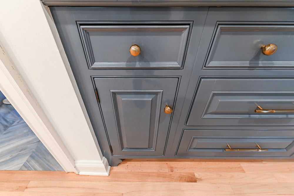 Traditional White Kitchen with Island, Appliances and Marble Countertops