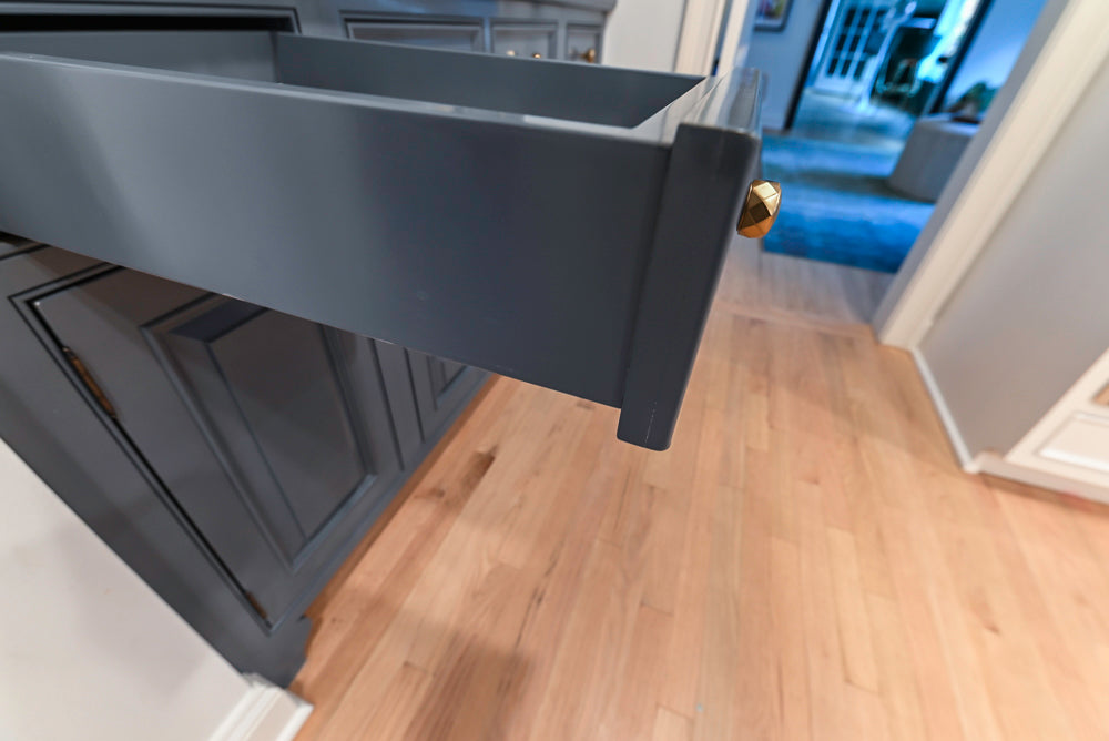 Traditional White Kitchen with Island, Appliances and Marble Countertops