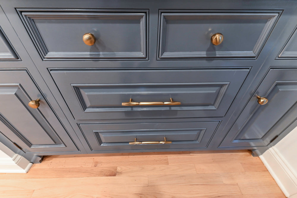 Traditional White Kitchen with Island, Appliances and Marble Countertops