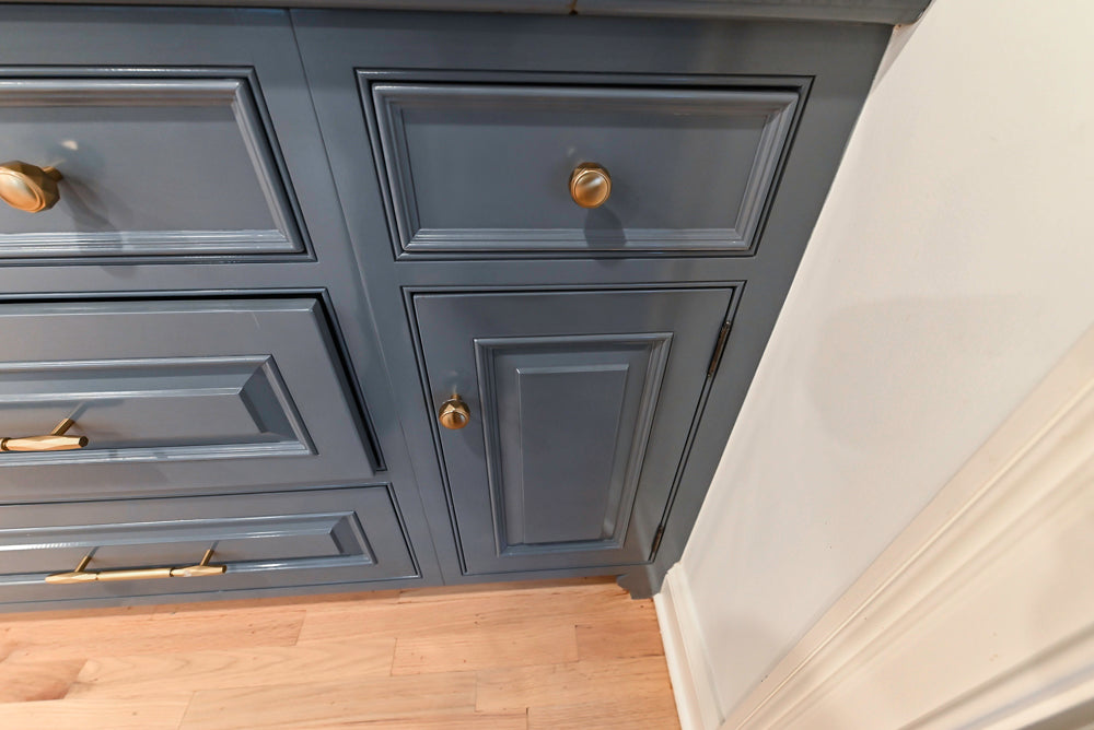 Traditional White Kitchen with Island, Appliances and Marble Countertops