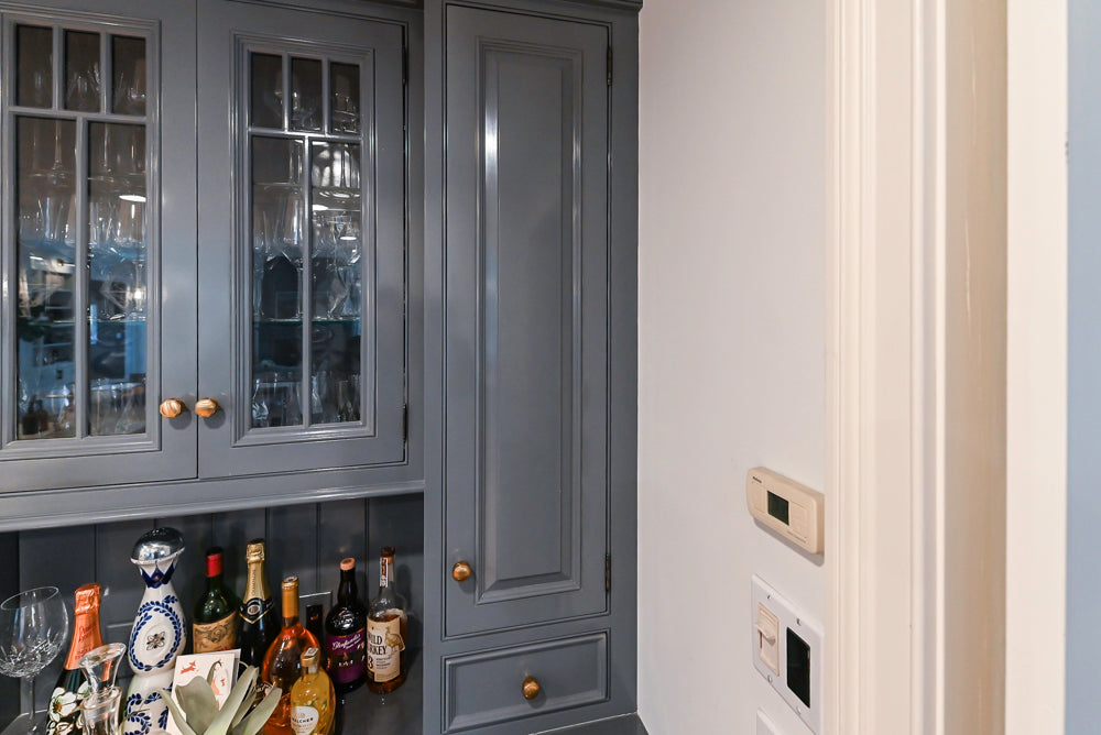 Traditional White Kitchen with Island, Appliances and Marble Countertops