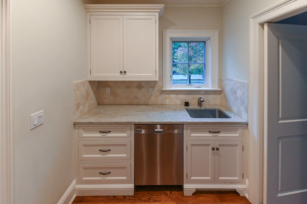 Traditional White Butler's Pantry with Light Granite Countertops