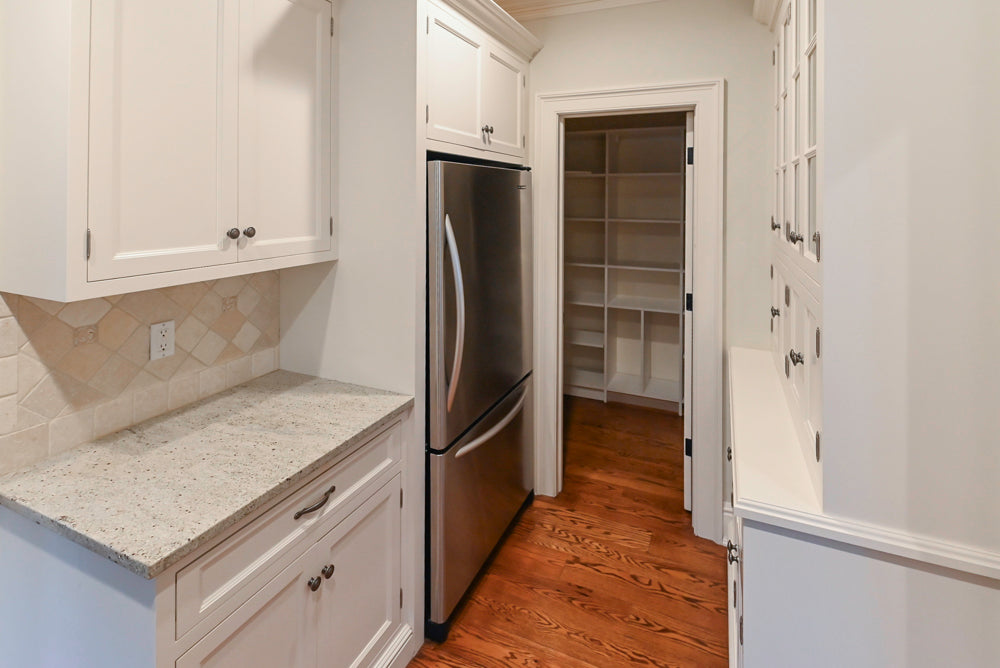 Traditional White Butler's Pantry with Light Granite Countertops