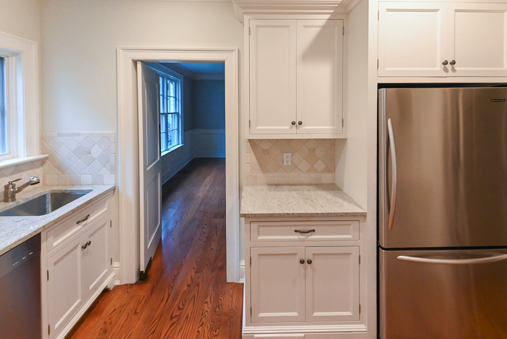 Traditional White Butler's Pantry with Light Granite Countertops