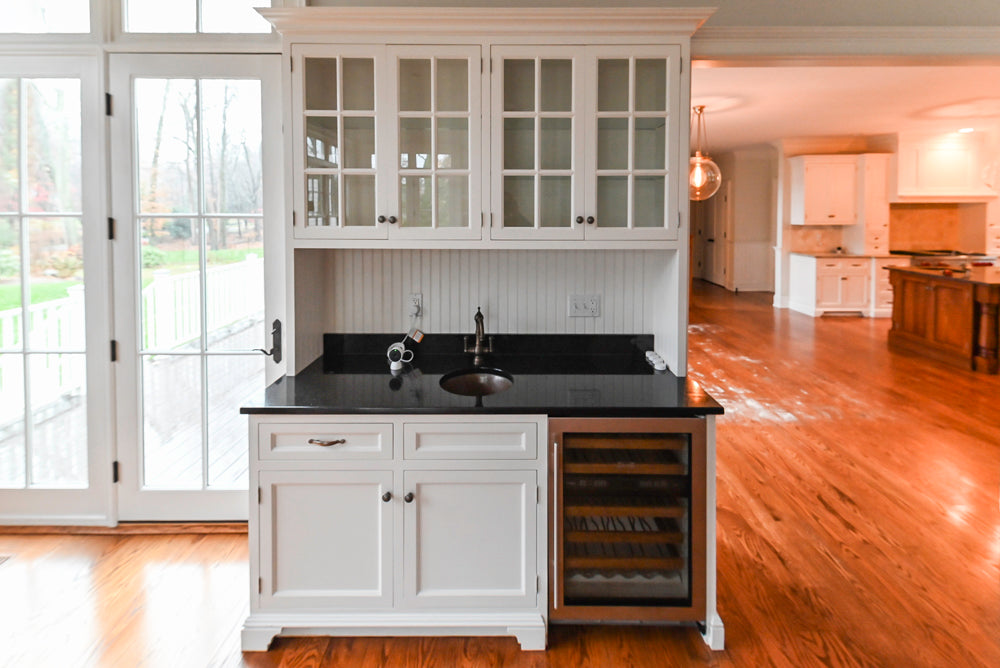 Traditional White Wet Bar Area with Black Granite Countertops