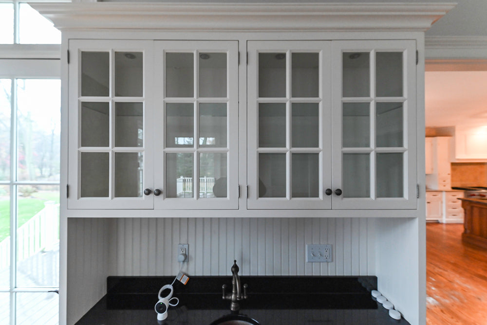 Traditional White Wet Bar Area with Black Granite Countertops