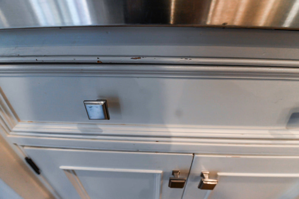 Craft-Maid Custom Cabinetry Traditional White Kitchen with Grey Island and Appliances