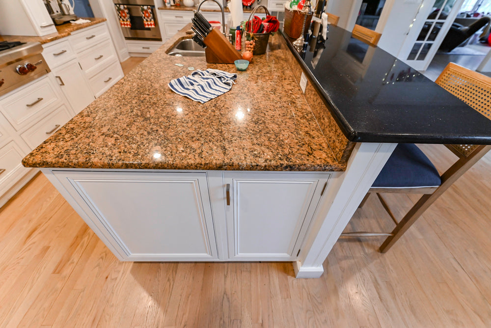 Traditional White Kitchen with Island, Granite Countertops and High-End Appliances