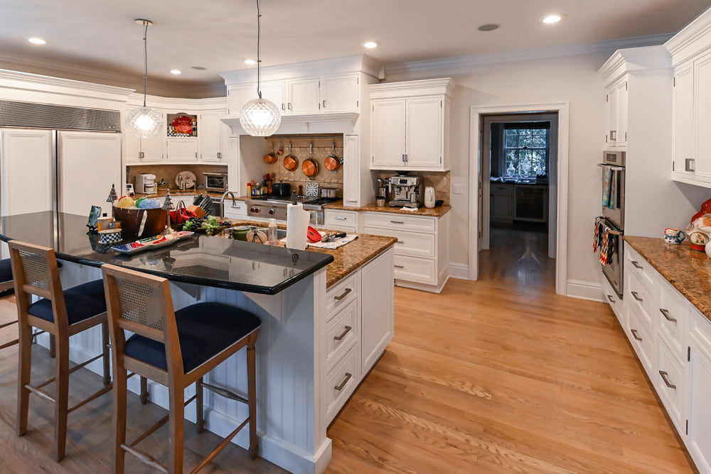 Traditional White Kitchen with Island, Granite Countertops and High-End Appliances