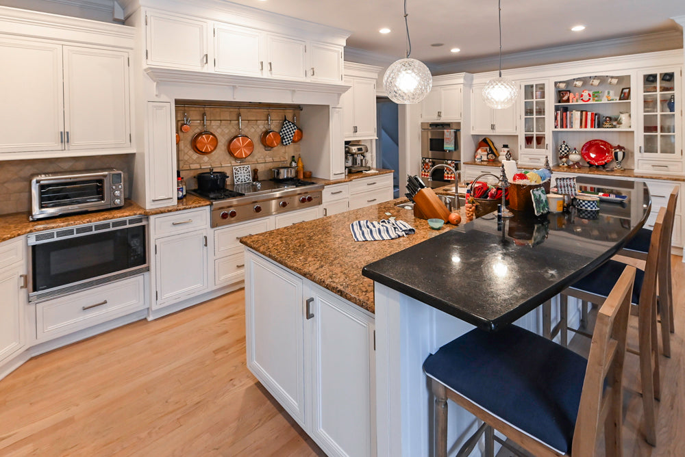 Traditional White Kitchen with Island, Granite Countertops and High-End Appliances
