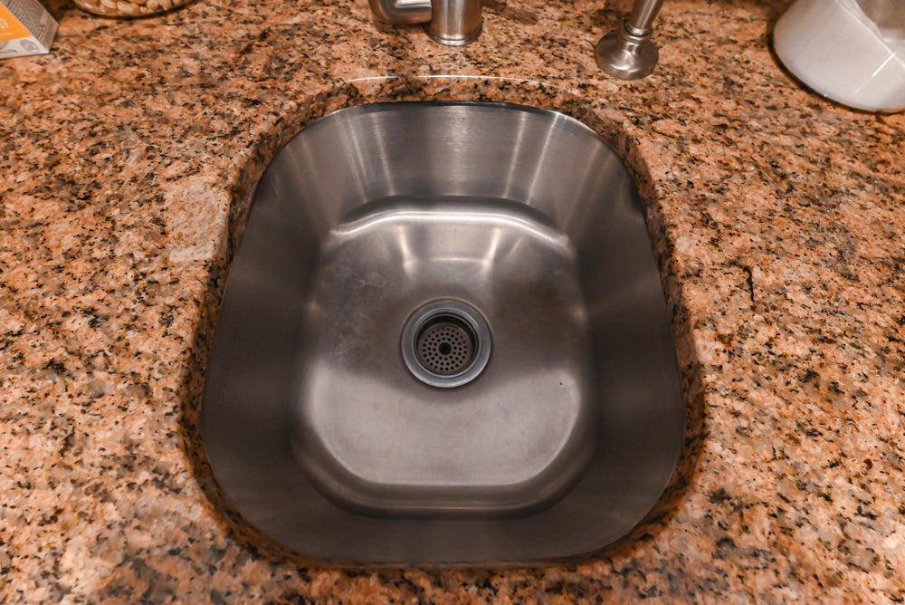 Traditional White Kitchen with Island, Granite Countertops & High-End Appliances