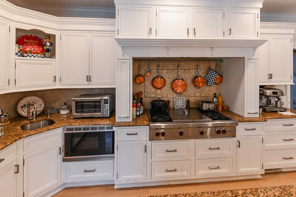 Traditional White Kitchen with Island, Granite Countertops and High-End Appliances