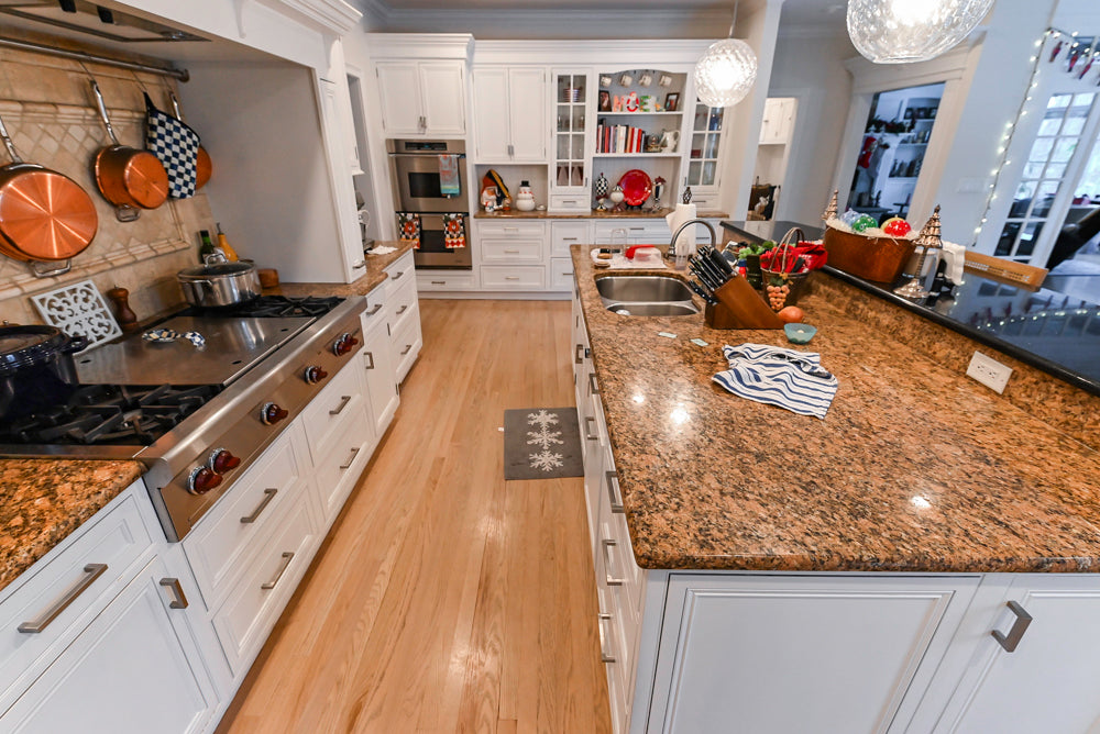 Traditional White Kitchen with Island, Granite Countertops and High-End Appliances