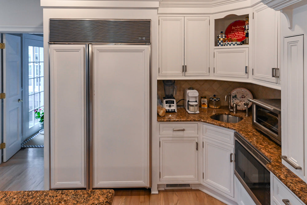 Traditional White Kitchen with Island, Granite Countertops and High-End Appliances