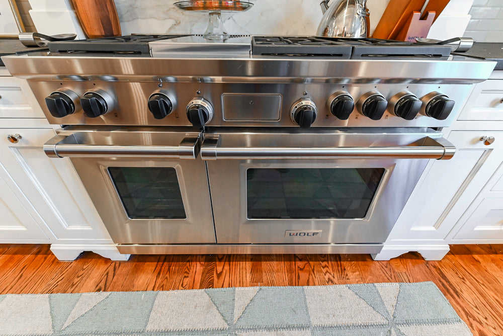 Traditional White Kitchen with Marble Top Island, Desk Area & Luxe Appliances