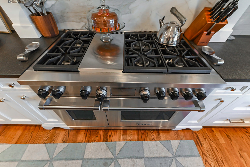 Traditional White Kitchen with Marble Top Island, Desk Area & Luxe Appliances
