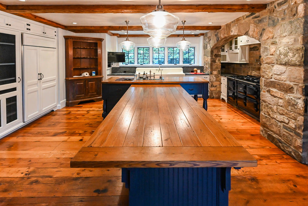 Rustic Traditional White & Navy Kitchen with Black AGA Range, Wood Top Island & Soapstone Countertops
