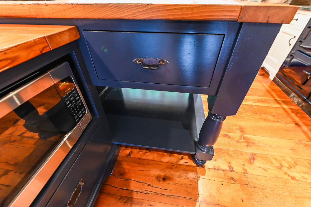 Rustic Traditional White & Navy Kitchen with Black AGA Range, Wood Top Island & Soapstone Countertops