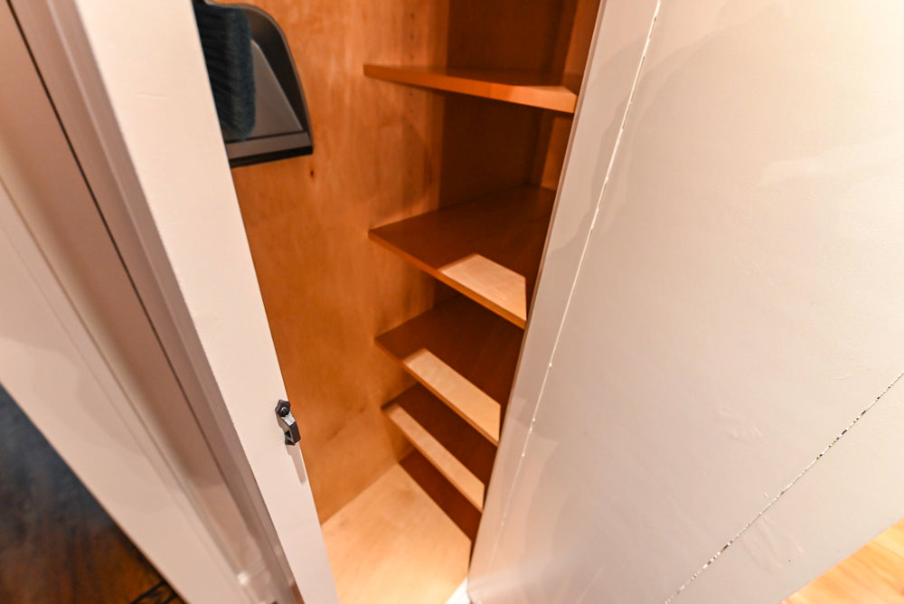 Rustic Traditional White & Navy Kitchen with Black AGA Range, Wood Top Island & Soapstone Countertops