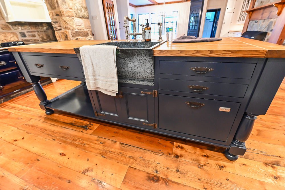 Rustic Traditional White & Navy Kitchen with Black AGA Range, Wood Top Island & Soapstone Countertops