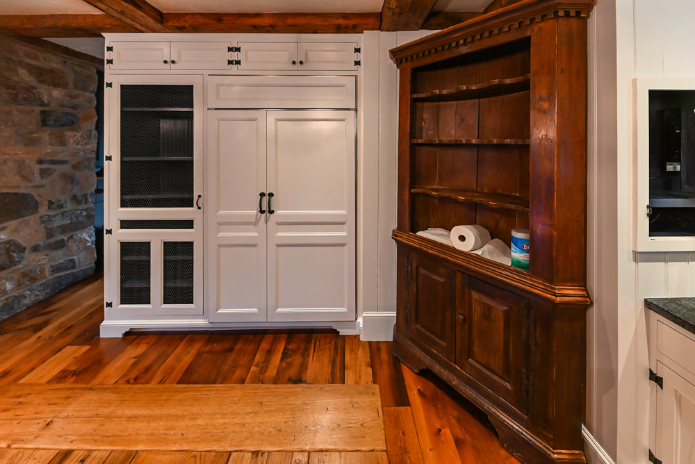 Rustic Traditional White & Navy Kitchen with Black AGA Range, Wood Top Island & Soapstone Countertops